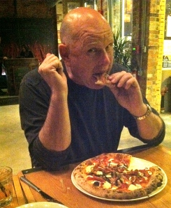 Dad loves his pizza. 
